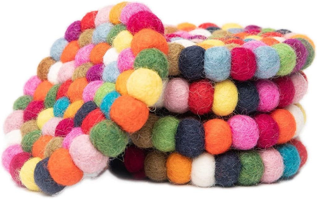 Stack of colorful felted merino wool candle coasters on a white background