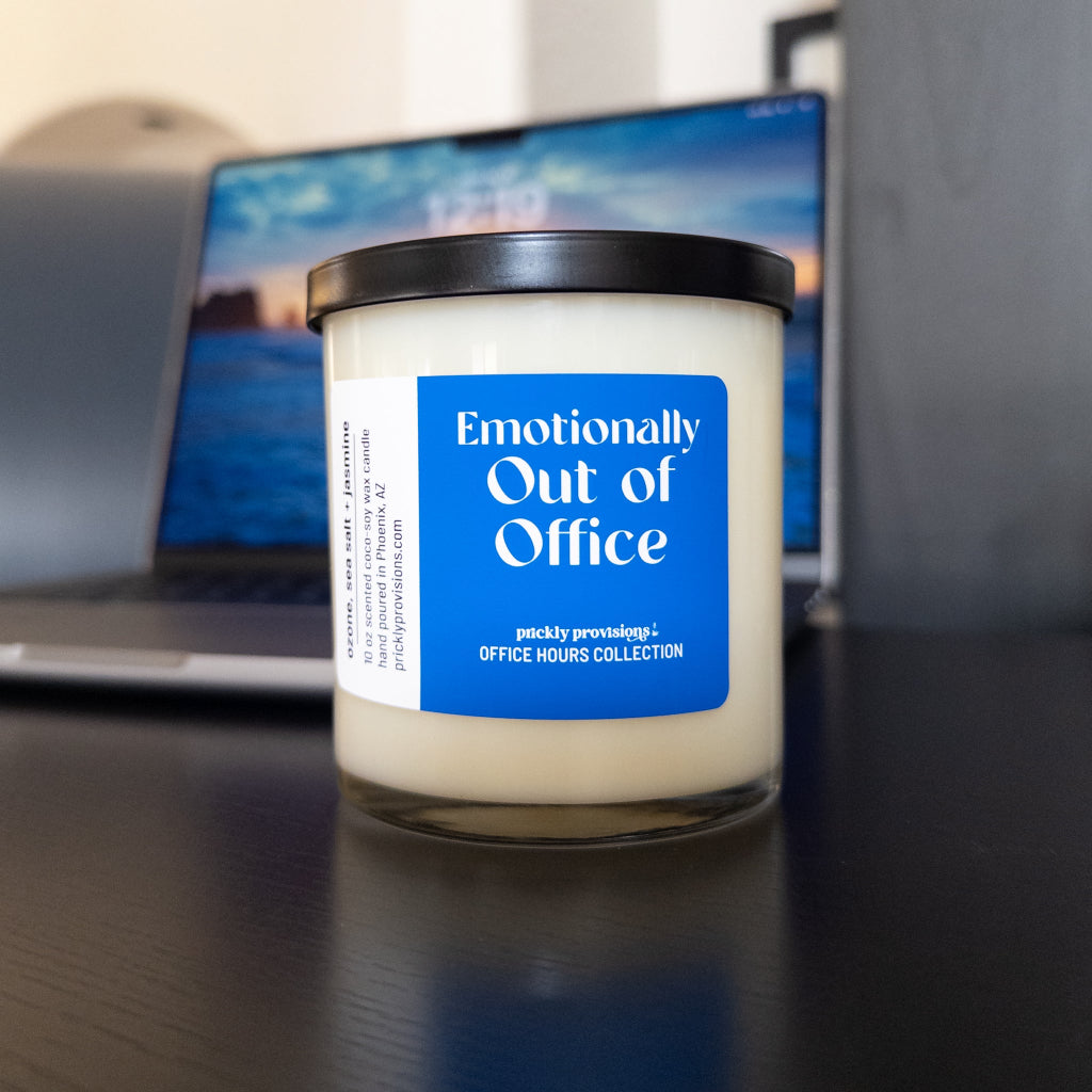 Emotionally Out of Office 10 oz double-wick office candle with black metal lid.
