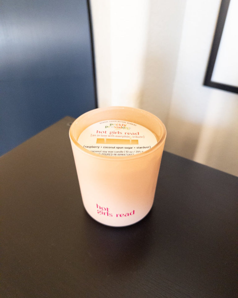 Hot Girls Read 10 oz double-wick candle in a matte blush glass vessel.