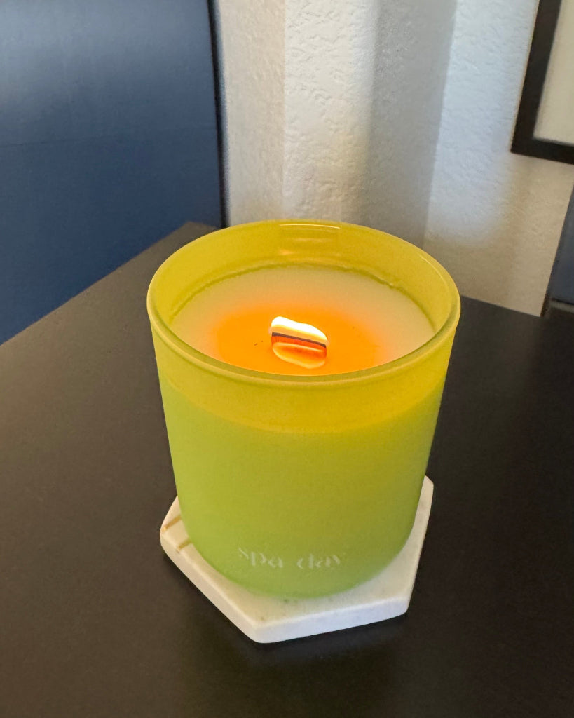 Spa Day 12 oz wood-wick candle in a matte lime green glass vessel.