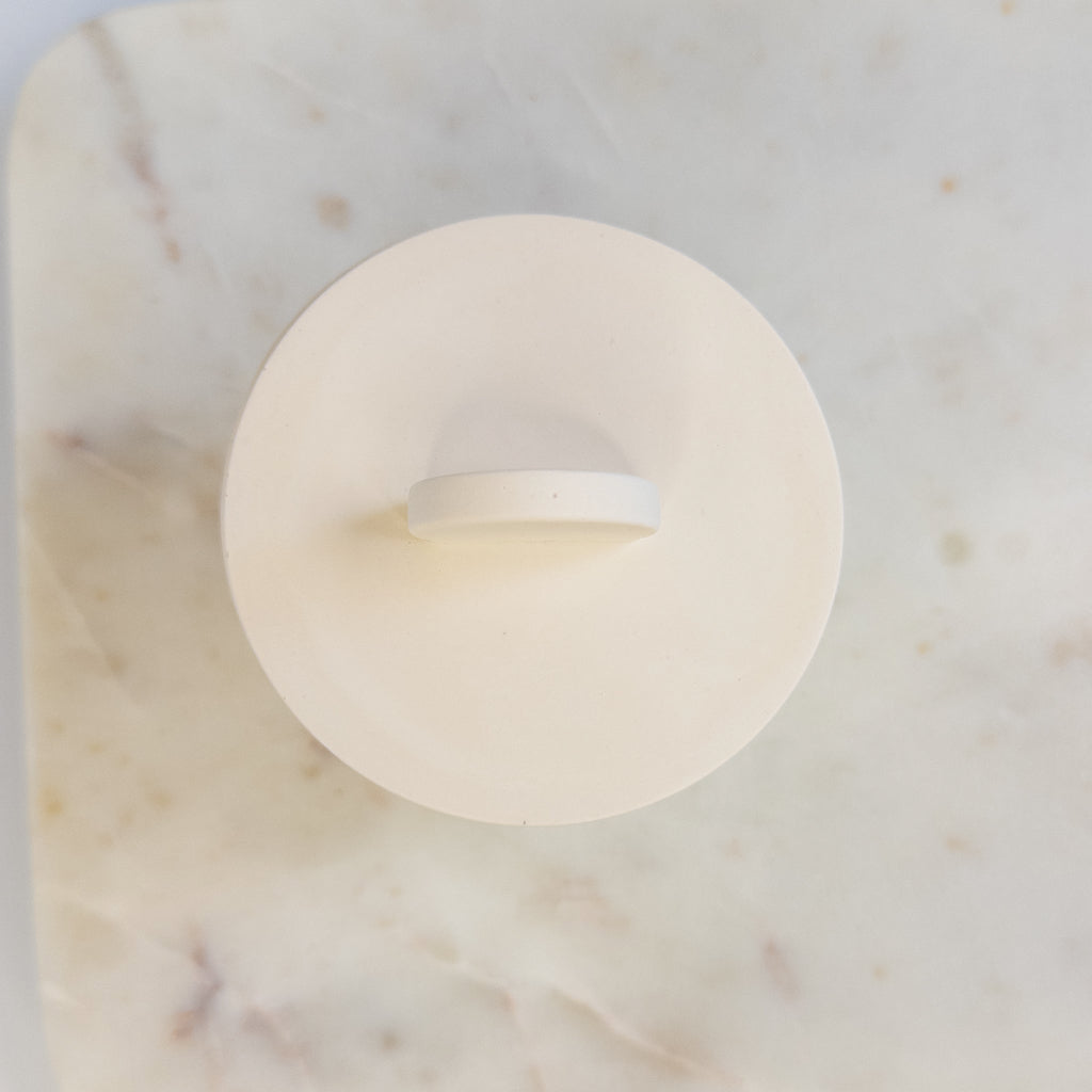 Creamy white 8 oz cement candle with matching lid and wooden wick.
