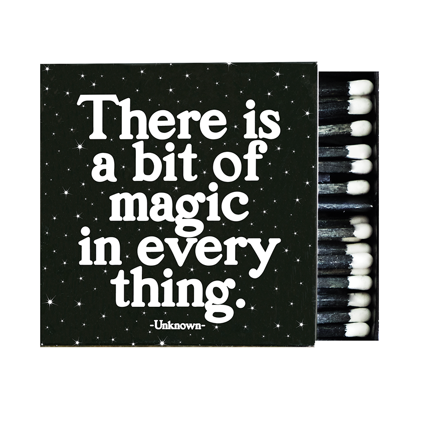 Matchbox with motivational quote 'There is a bit of magic in everything' by Unknown on a black background.