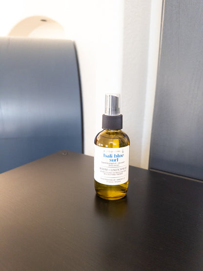 Bali Blue Surf 4 oz room and linen spray in a transparent green bottle with black sprayer