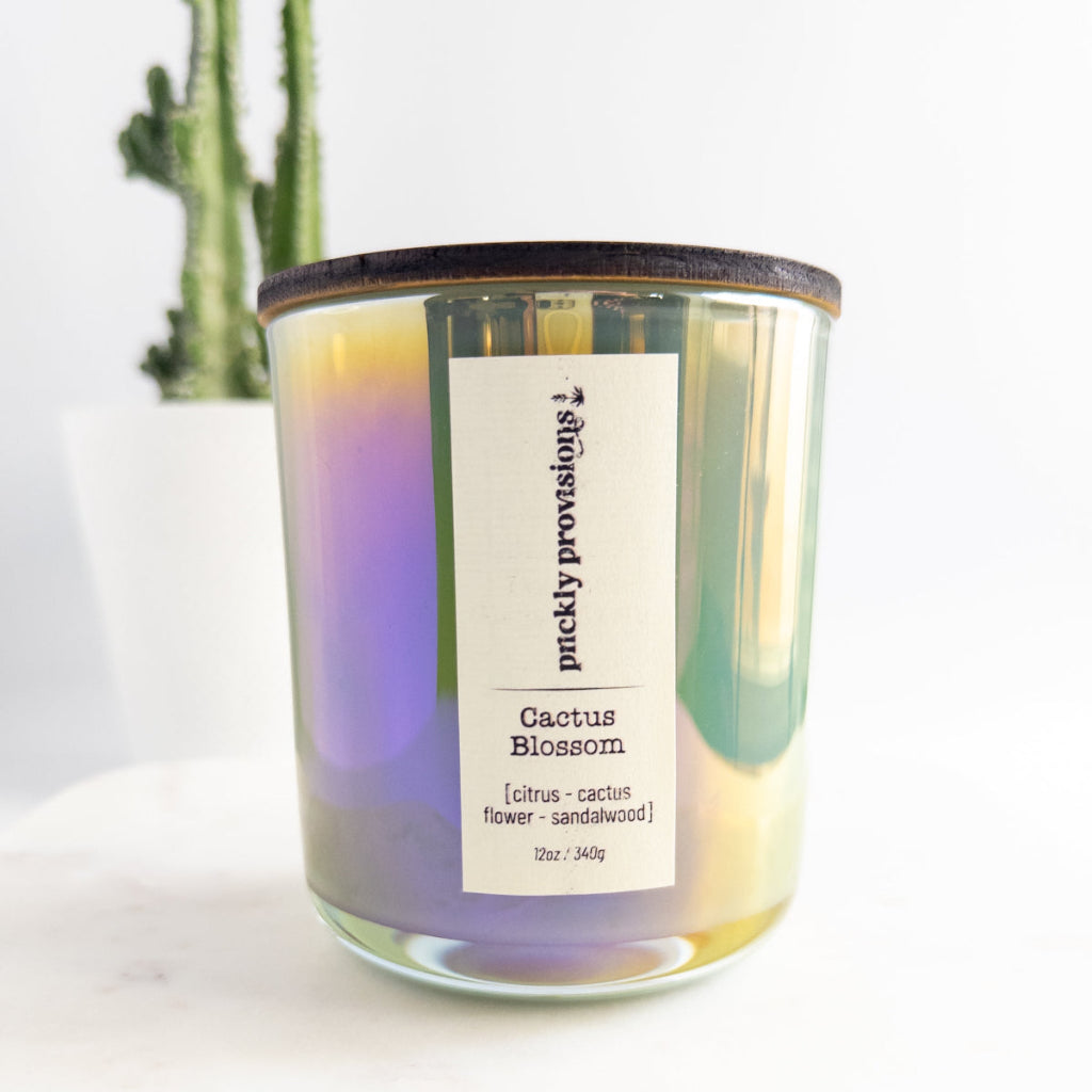 Cactus Blossom 12 oz wood-wick candle in an iridescent sage glass vessel with coordinating lid.