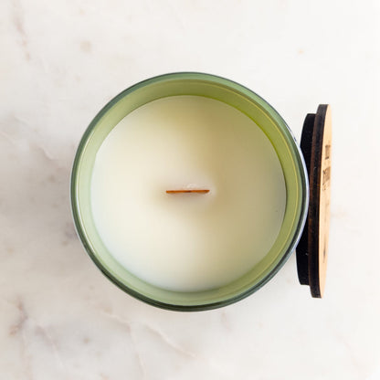 Cactus Blossom 12 oz wood-wick candle in an iridescent sage glass vessel with coordinating lid.