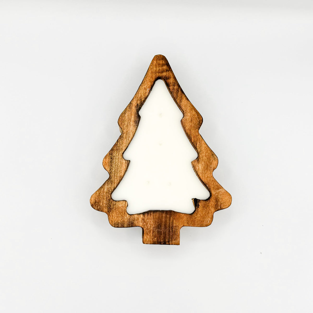 A Christmas tree shaped natural stained wooden dough bowl candle with 4 wicks