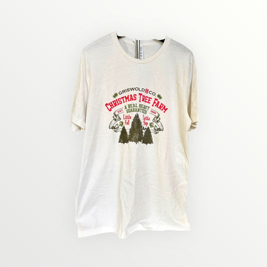 White t-shirt with Christmas tree farm graphic on a white background