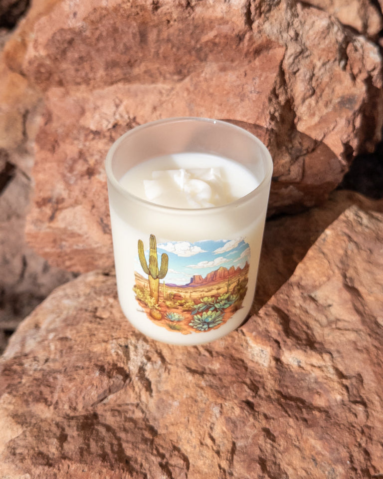Desert Rain coconut soy candle in a printed frosted glass vessel with an Arizona desert landscape.