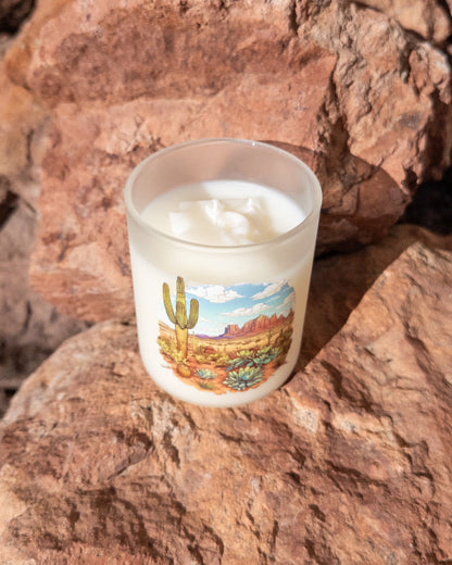 Desert Rain coconut soy candle in a printed frosted glass vessel with an Arizona desert landscape.