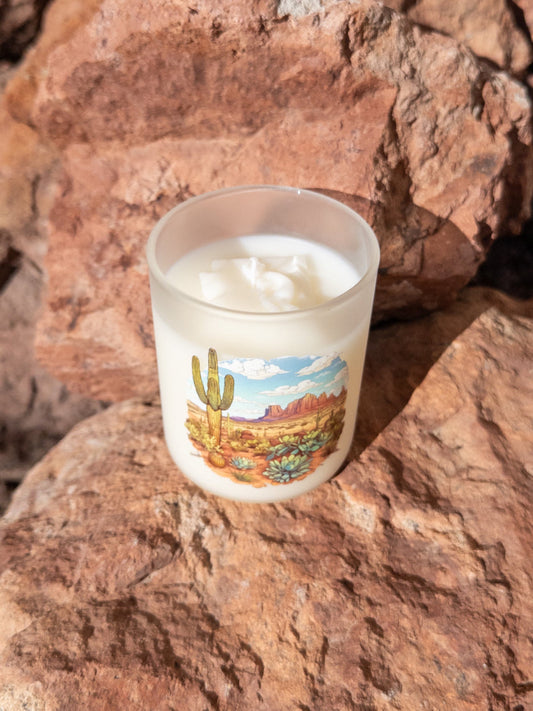 Desert Rain coconut soy candle in a printed frosted glass vessel with an Arizona desert landscape.