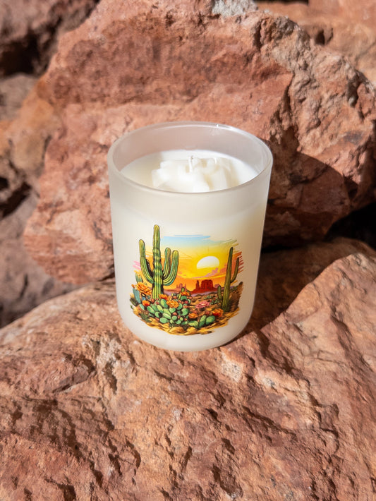 Candle with desert design on a rock