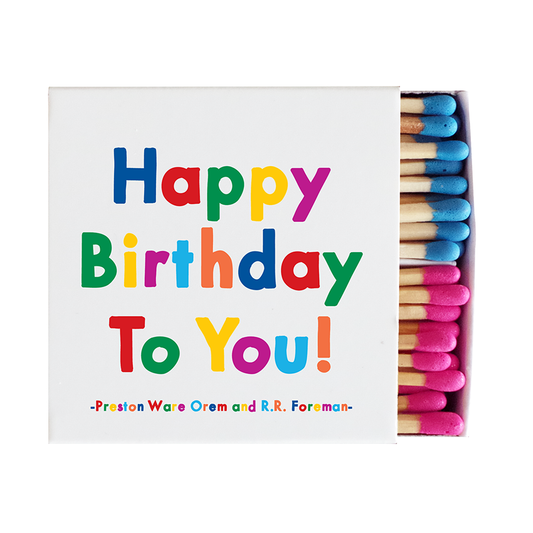 Matchbox with colorful 'Happy Birthday To You!' text and matches inside.