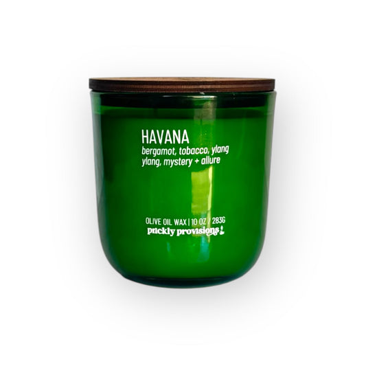 Green candle with wooden lid labeled 'Havana' on a white background