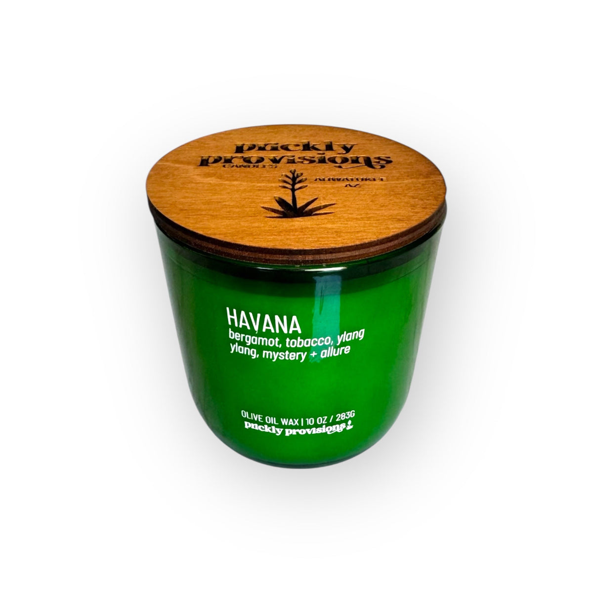 Green candle with wooden lid labeled 'Havana' by Puckly Provisions on a white background