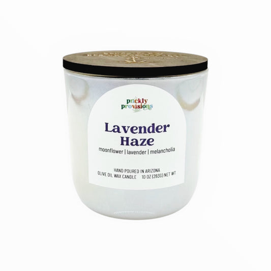Candle in a glass jar with a label on a white background