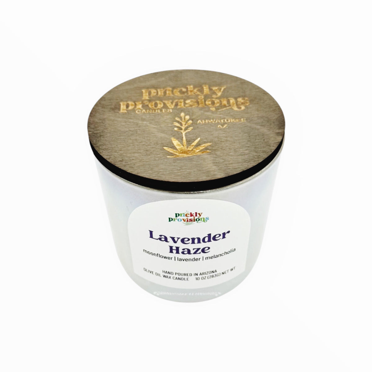 Candle with wooden lid labeled 'Lavender Haze' by 'Pruckly Provisions'.