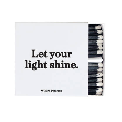 Matches with 'Let your light shine' quote by Wilfred Peterson on a white background
