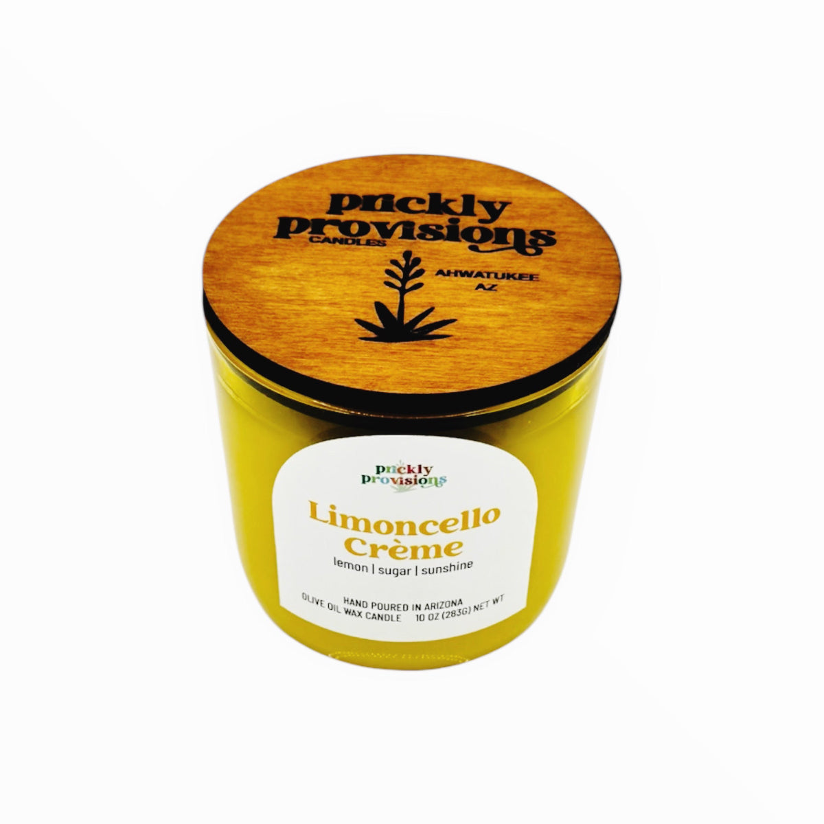 Yellow candle with wooden lid labeled 'Prickly Provisions' on a white background