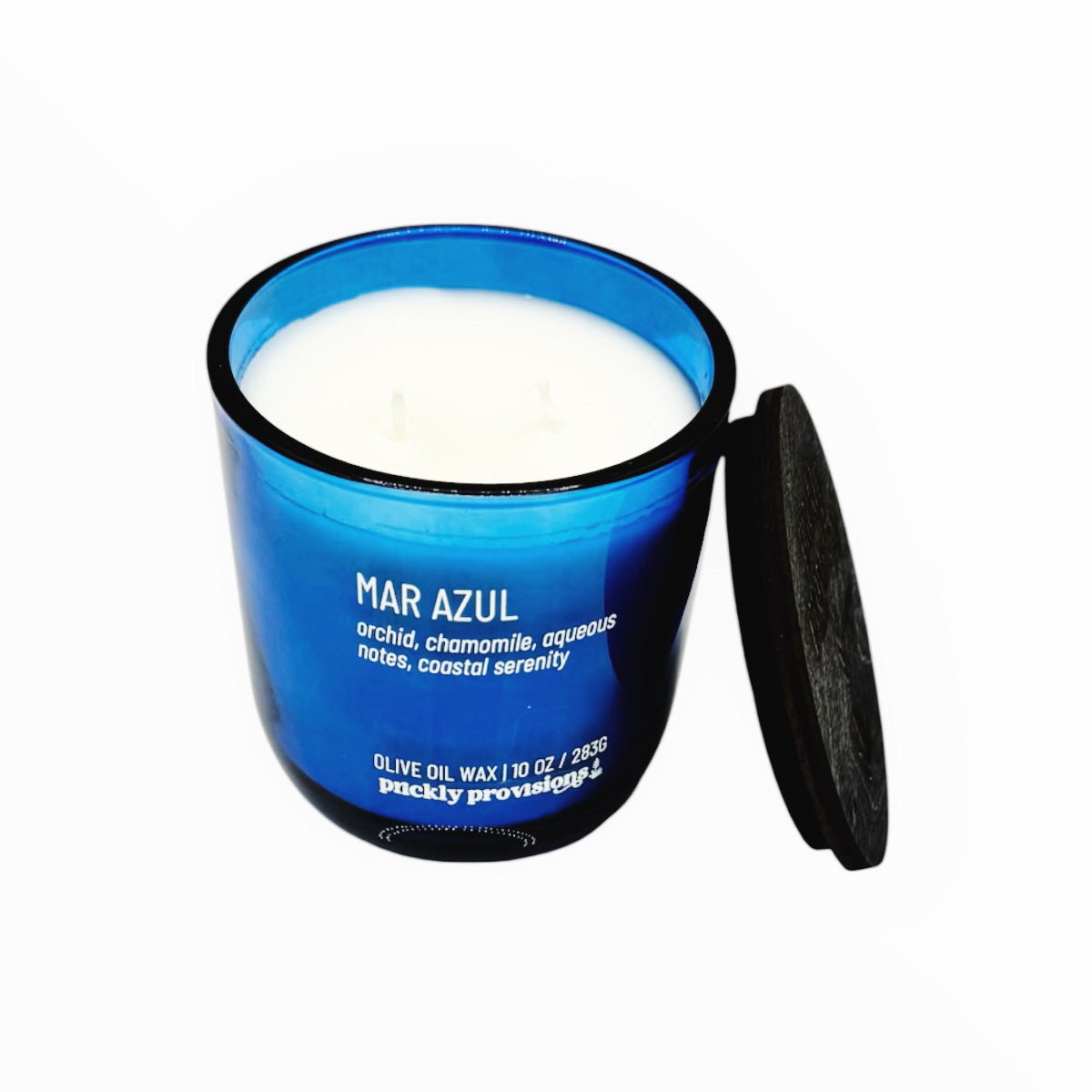 Blue candle jar with white wax labeled 'Mar Azul' on a white background