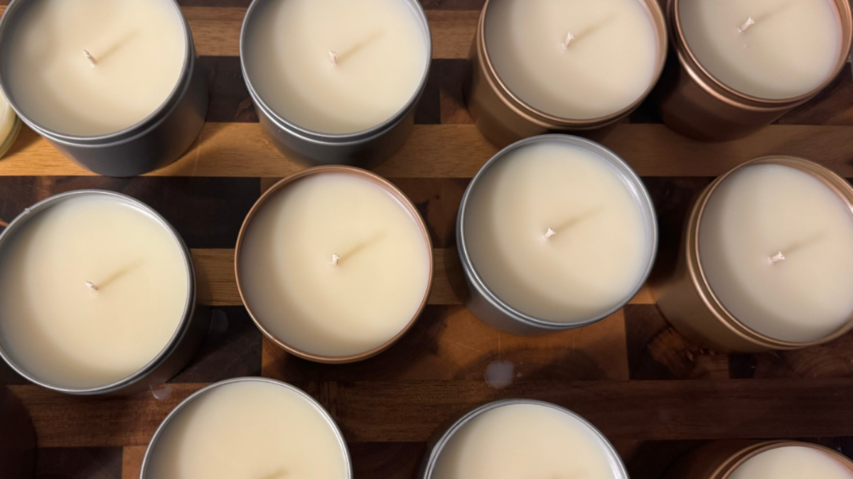 Single wick candles in metal tins shot from above