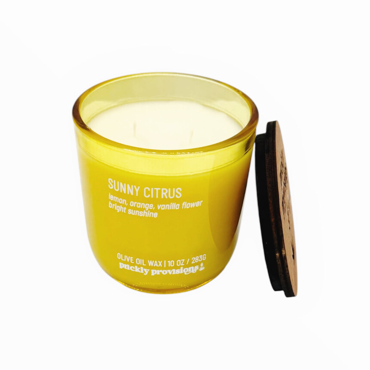 Yellow candle with a wooden lid on a white background