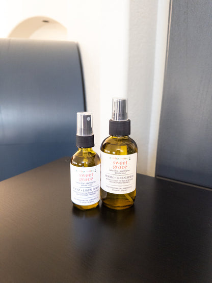 Sweet Grace 2 oz and 4 oz room and linen sprays in transparent green bottles