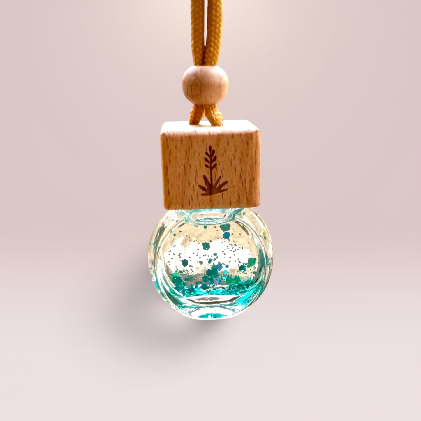 Sweet Grace 8 mL hanging car diffuser with decorative shimmer, engraved wooden lid, and hanging cord.