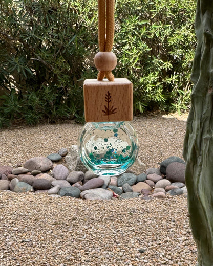 Sweet Grace 8 mL hanging car diffuser with decorative shimmer, engraved wooden lid, and hanging cord.