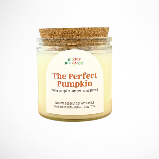 Candle jar labeled 'The Perfect Pumpkin' with a cork lid on a white background