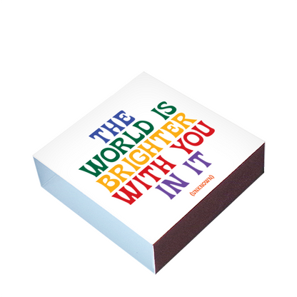 Colorful motivational quote on a matchbox with a white background
