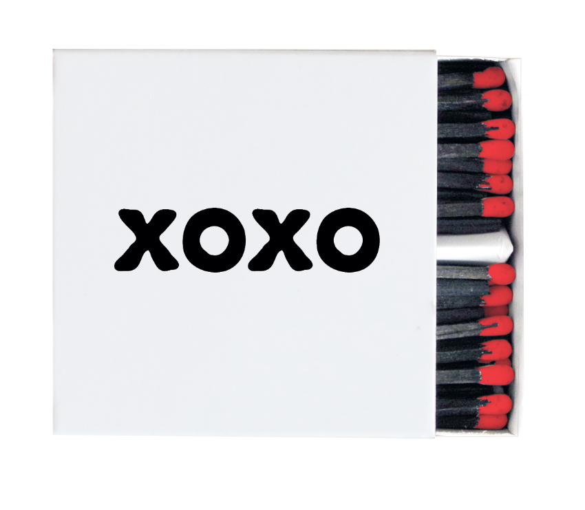 White XOXO decorative matchbox with black lettering, black matches, and red tips
