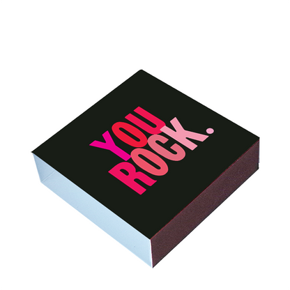 Black box with 'YOU ROCK' text in pink on a white background