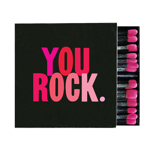 Matchbox with 'YOU ROCK.' text in pink on a black background
