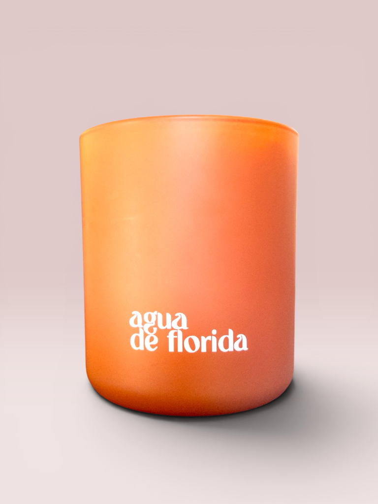Agua de Florida 9 oz double-wick candle in a matte clay glass vessel.