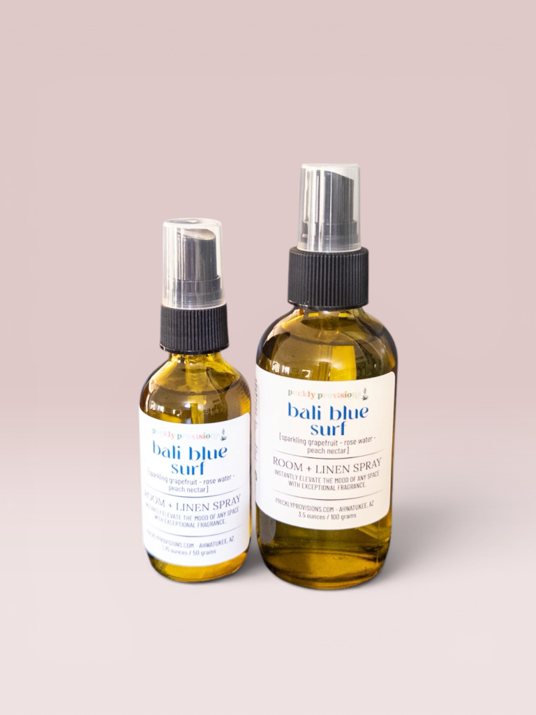 Bali Blue Surf room and linen spray in 2 oz and 4 oz transparent green bottles