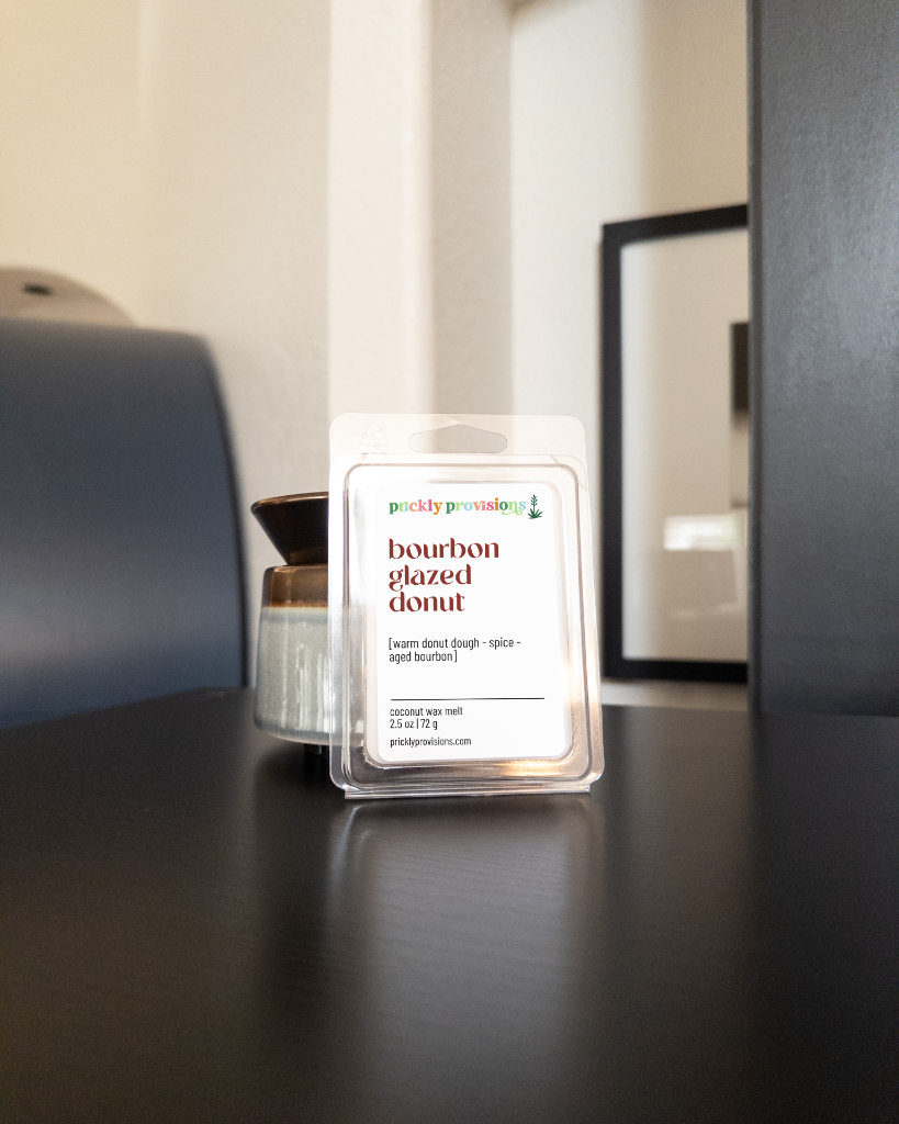 Bourbon Glazed Donut wax melts displayed beside an electric wax warmer