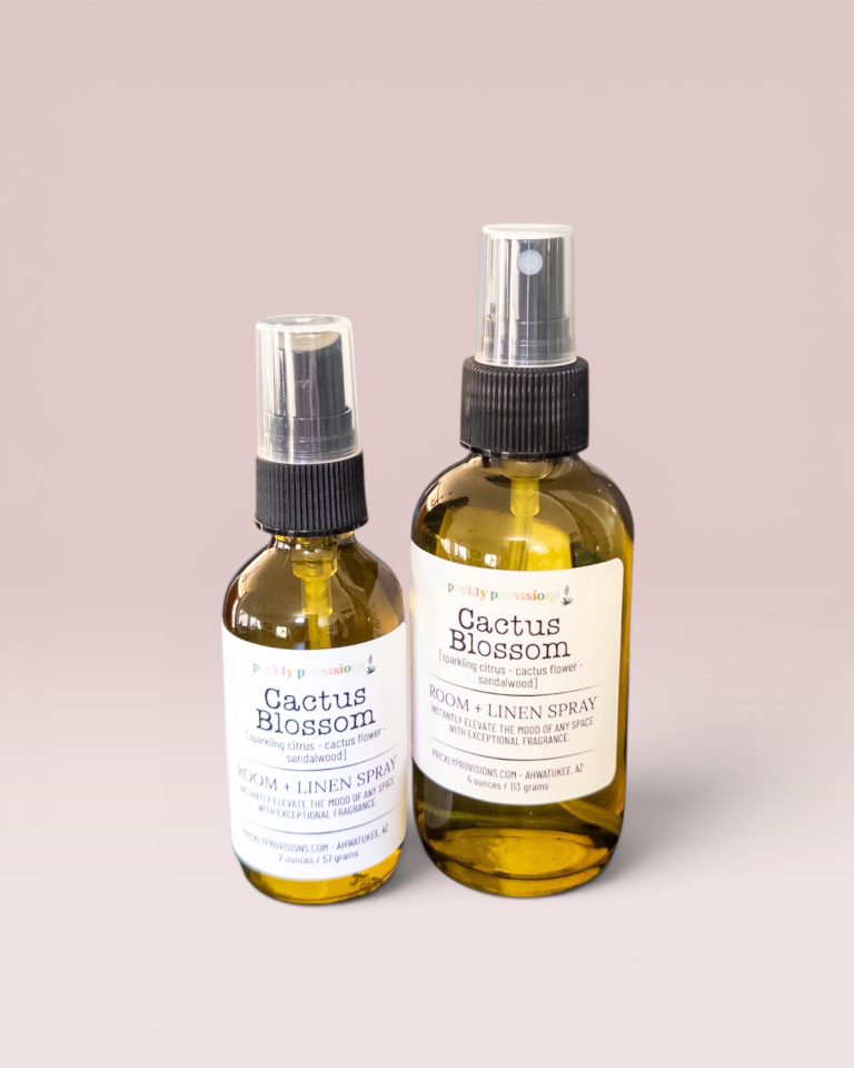 Cactus Blossom 2 oz and 4 oz room and linen spray in a transparent green bottle with a black sprayer.