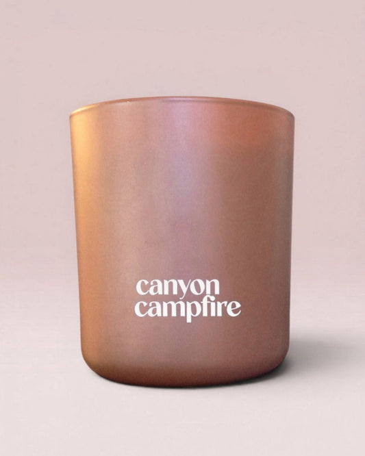 Canyon Campfire 9 oz double-wick candle in matte amber-brown glass with wooden lid
