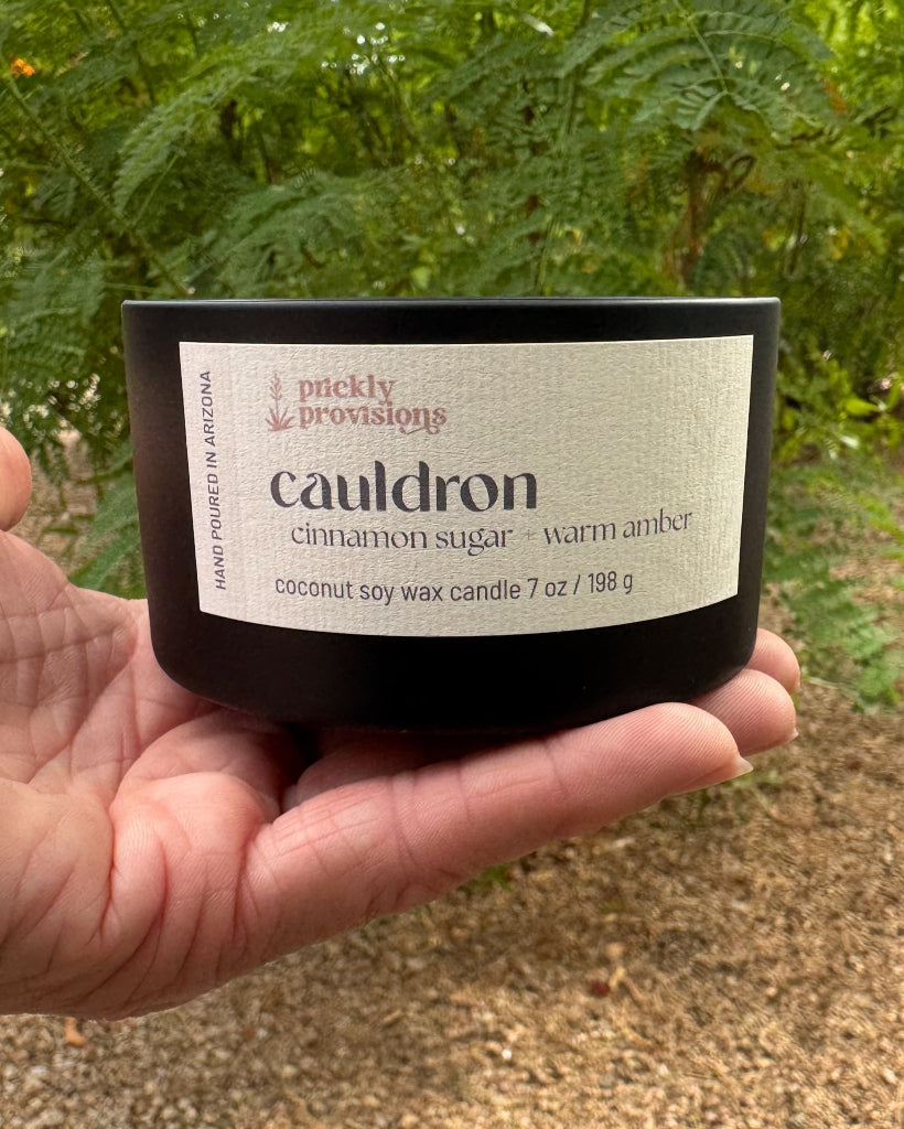 Cauldron Halloween candle in a matte black tin with 3-D printed lid