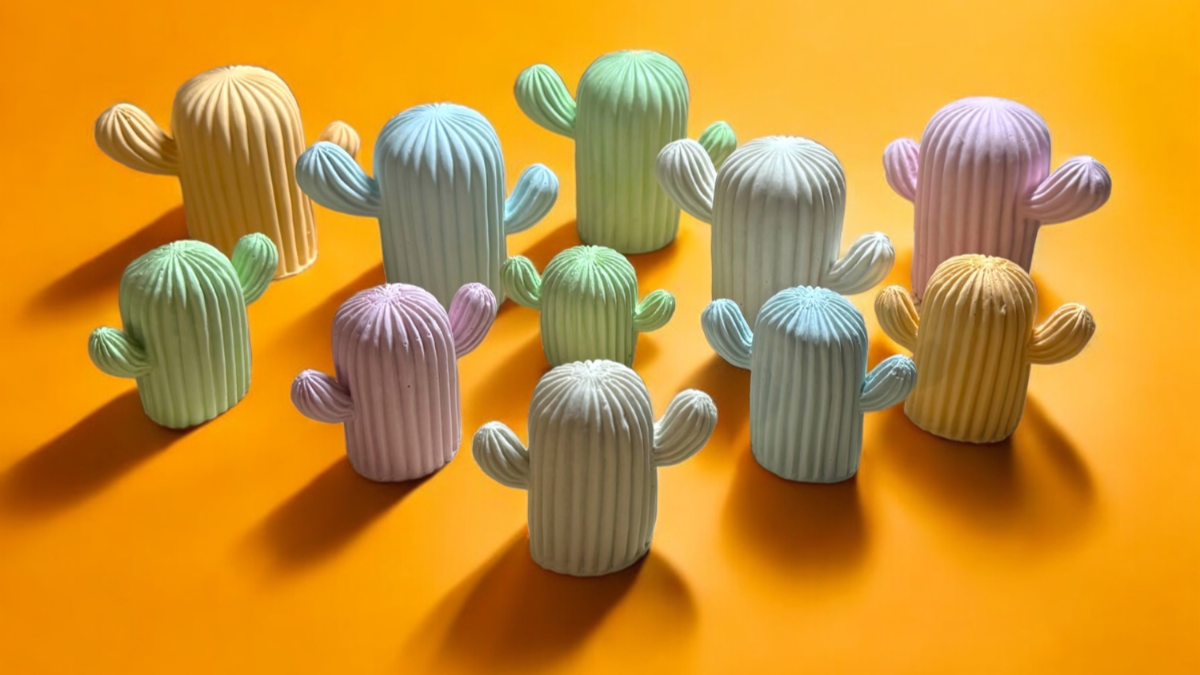colorful cute concrete cactus on an vibrant orange background handmade by prickly provisions