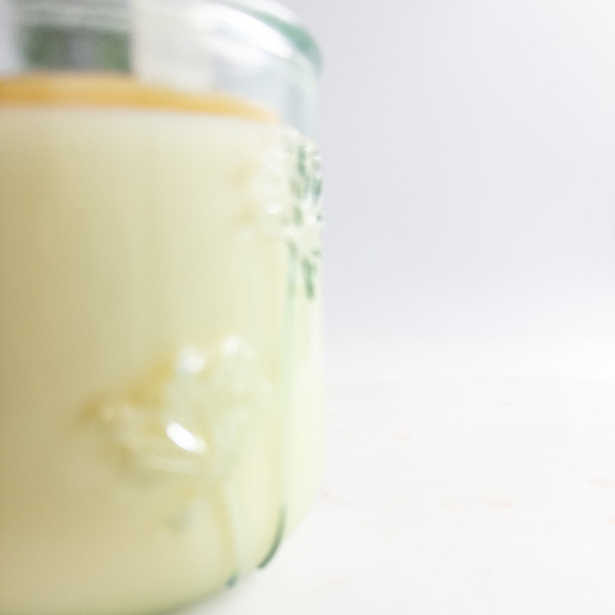 Close-up of a glass jar with a white background