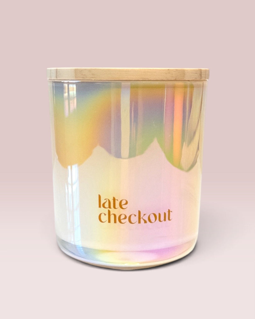 Late Checkout 12 oz wood-wick candle in iridescent ivory glass