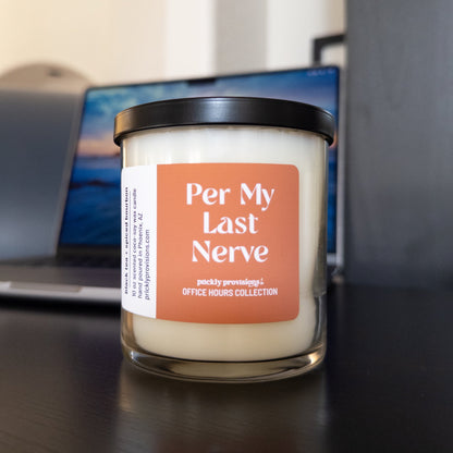 Per My Last Nerve 10 oz double-wick office candle with peach label and black metal lid.