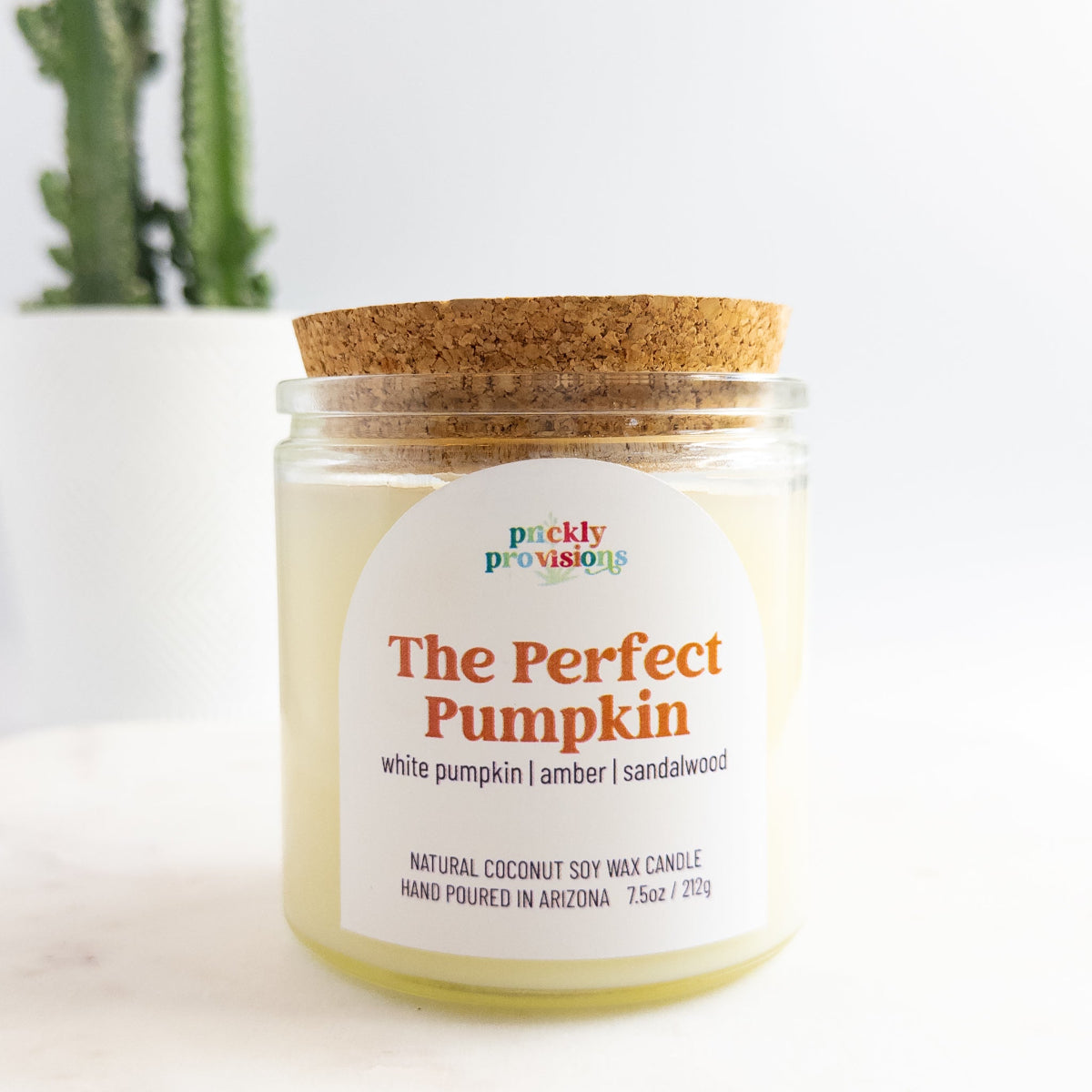 Candle jar labeled 'The Perfect Pumpkin' by Prickly Provisions on a white background