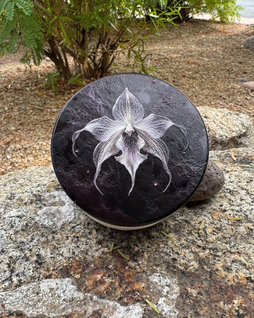 Closed matte black tin with the exclusive Phantom Orchid 3-D printed lid design
