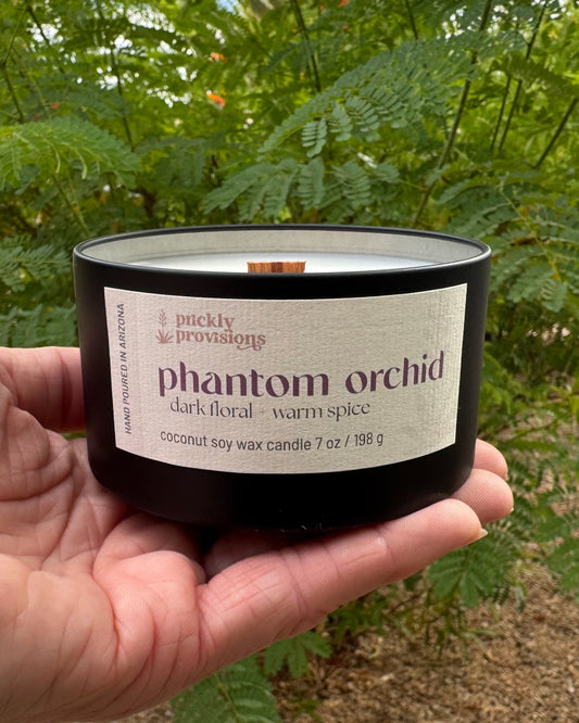 Phantom Orchid Halloween candle in a matte black tin with 3-D printed lid