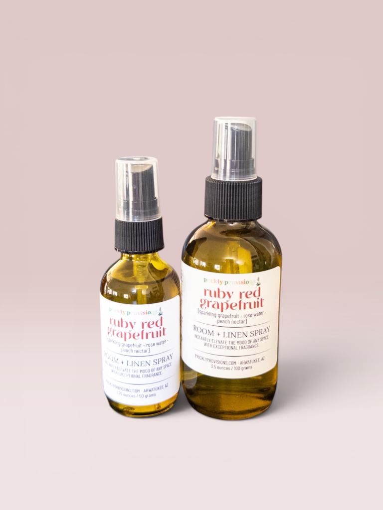 Ruby Red Grapefruit room and linen spray in 2 oz and 4 oz transparent green bottles
