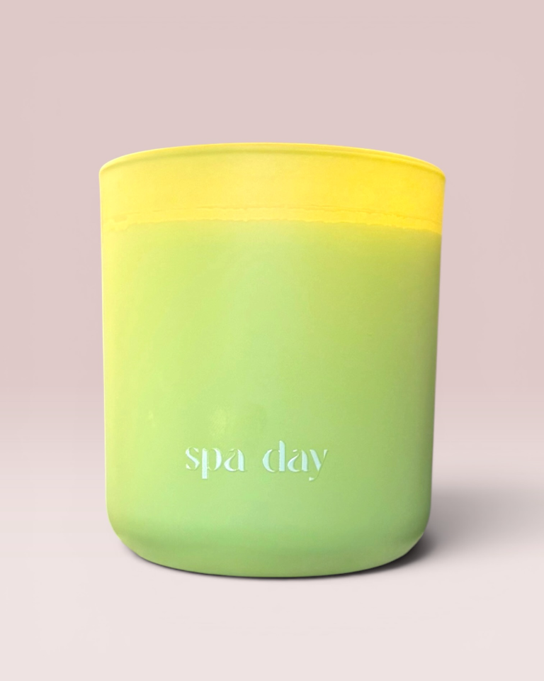Spa Day 12 oz wood-wick candle in a matte lime green glass vessel.