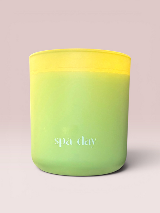 Spa Day 12 oz wood-wick candle in a matte lime green glass vessel.