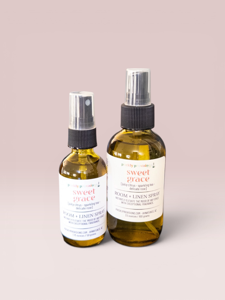 Sweet Grace 2 oz and 4 oz room and linen sprays in transparent green bottles